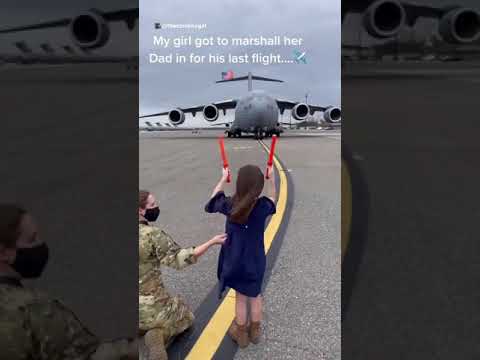 After 20 years of service, little girl marshals her dad in on his last flight